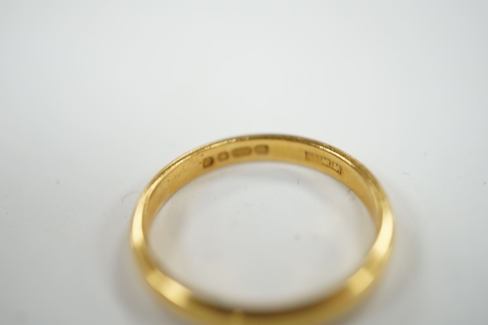 A 22ct gold wedding band, size N, 3.3 grams. Condition - fair to good